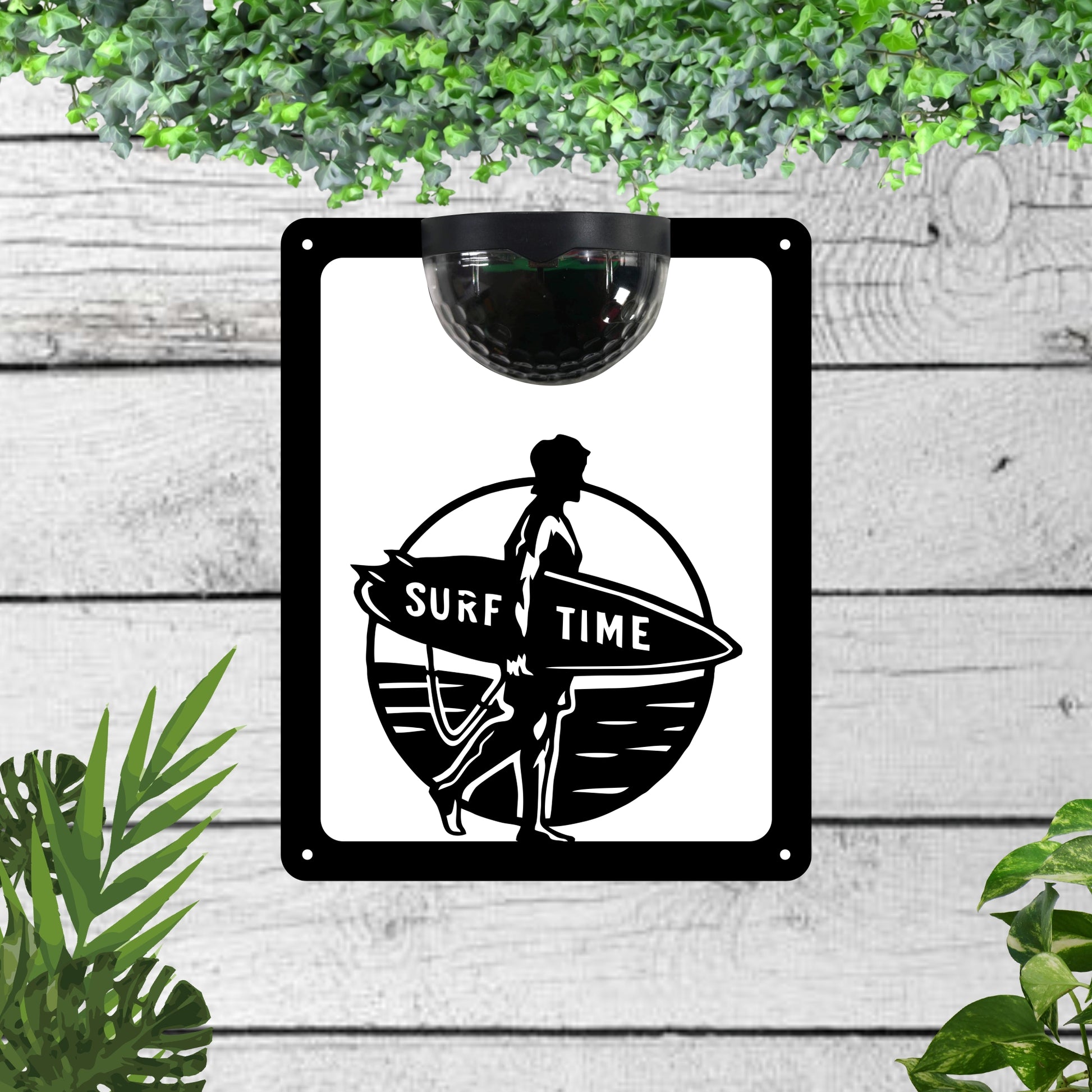 Garden solar wall plaque featuring a surfer | John Alans